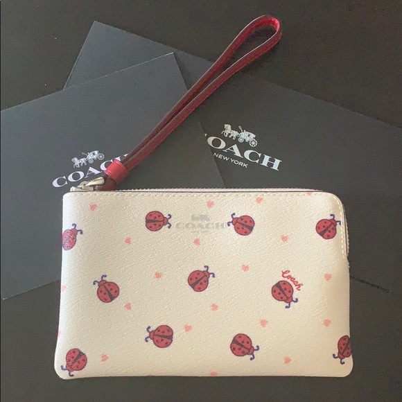Coach Handbags - Coach ladybug and heart wristlet NWT